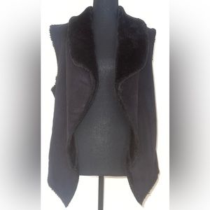 Faux suede and fur collared vest. Partially lined with faux fur on inside.